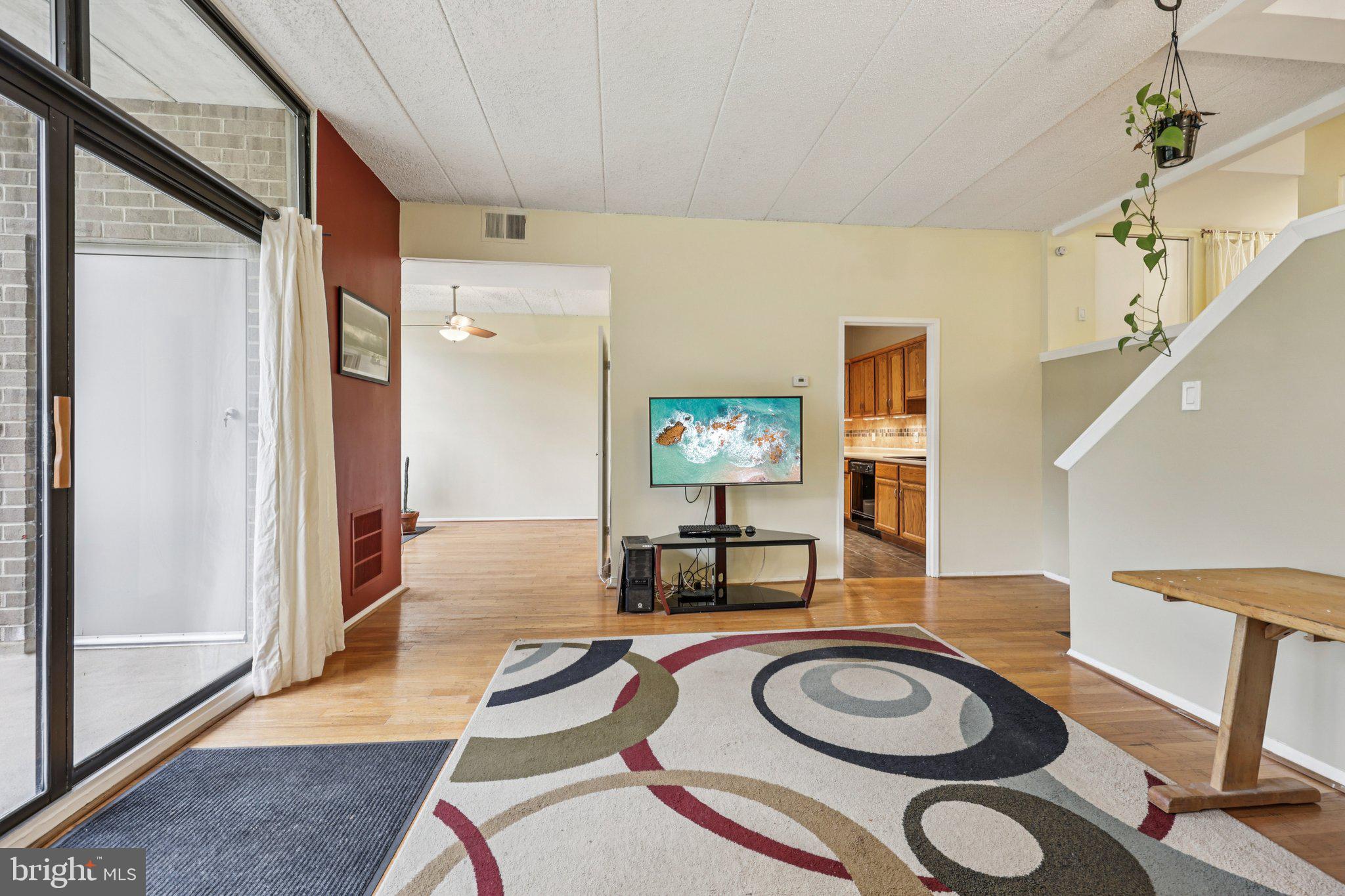 2118 Green Watch Way, Unit 10/201C Reston, VA 20191 - Photo 6 of 30 a living room with furniture and a table