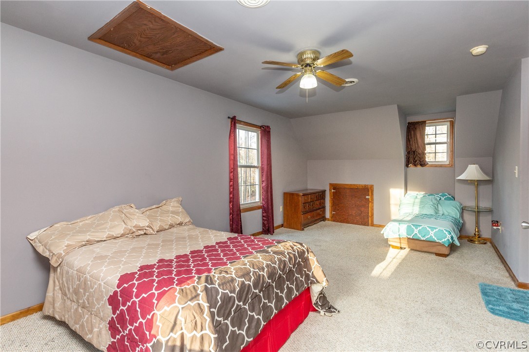 16190 Glebe Road Dewitt, VA 23840 - Photo 33 of 42 a bedroom with a bed and flowerpot