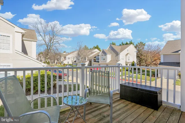 a view of a balcony with wooden floor