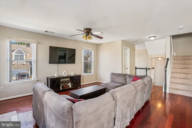 a living room with furniture fireplace and a flat screen tv