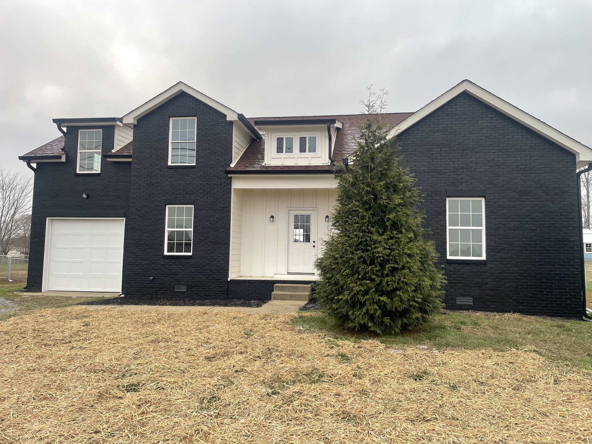 a front view of a house with a yard