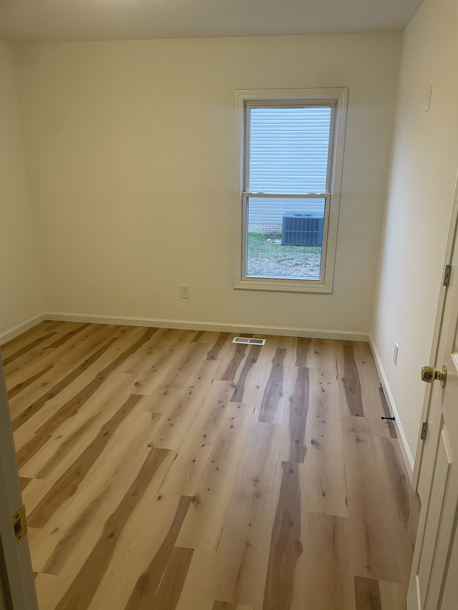 1039 Tylertown Road Clarksville, TN 37040 - Photo 16 of 20 a view of room with window and hardwood floor