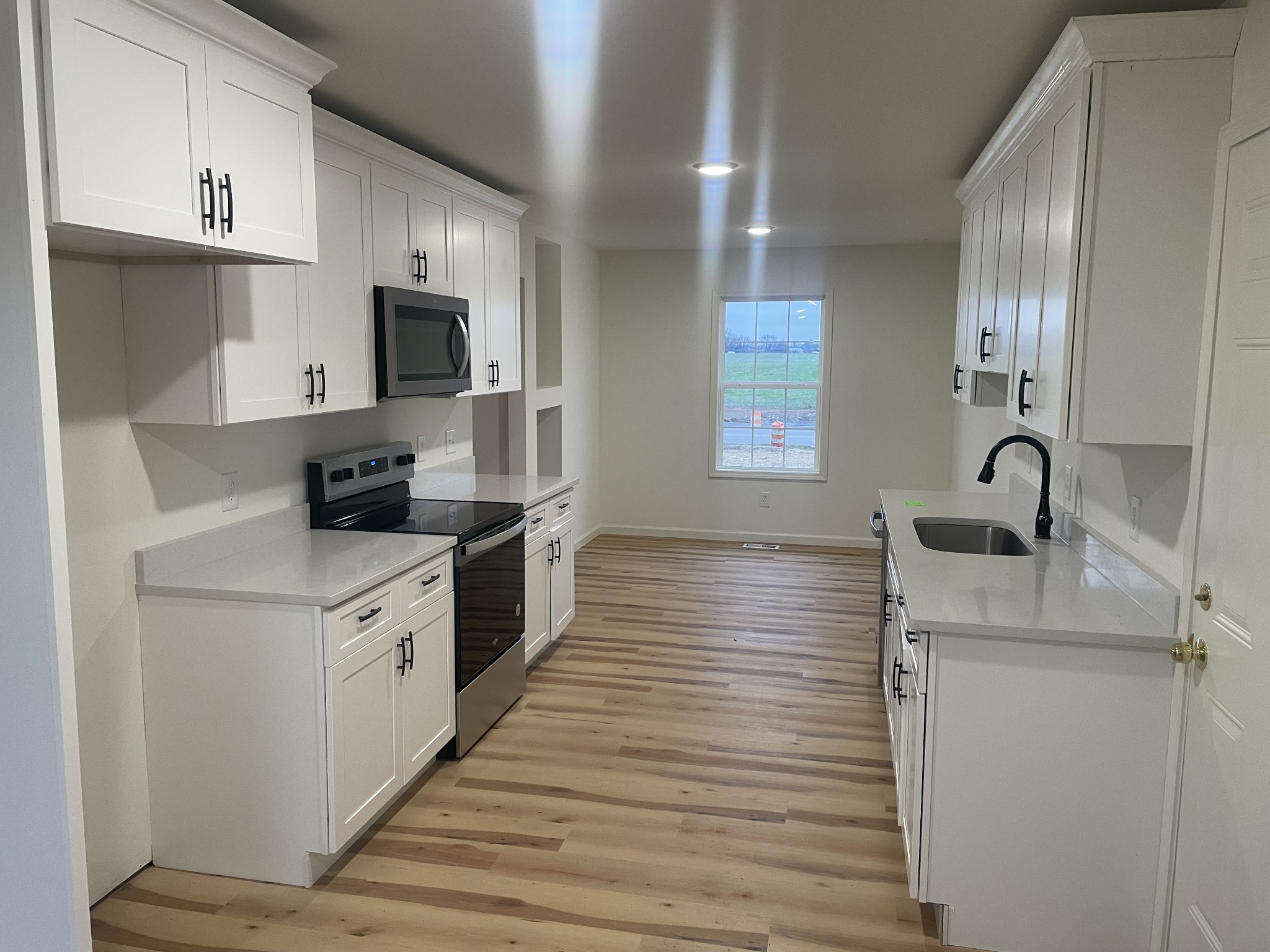 1039 Tylertown Road Clarksville, TN 37040 - Photo 7 of 20 a kitchen with stainless steel appliances granite countertop a sink stove and refrigerator