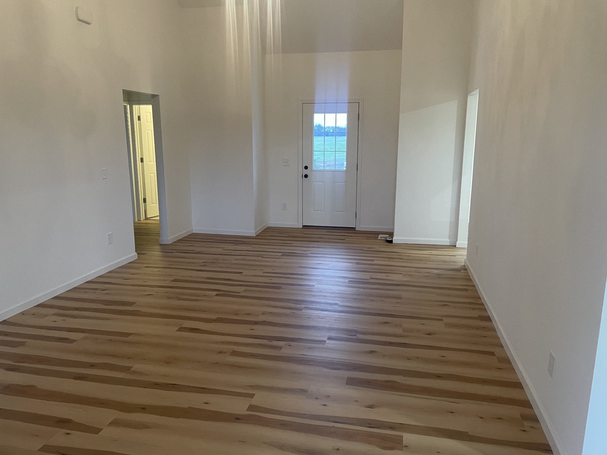 1039 Tylertown Road Clarksville, TN 37040 - Photo 9 of 20 a view of an empty room with wooden floor and a window