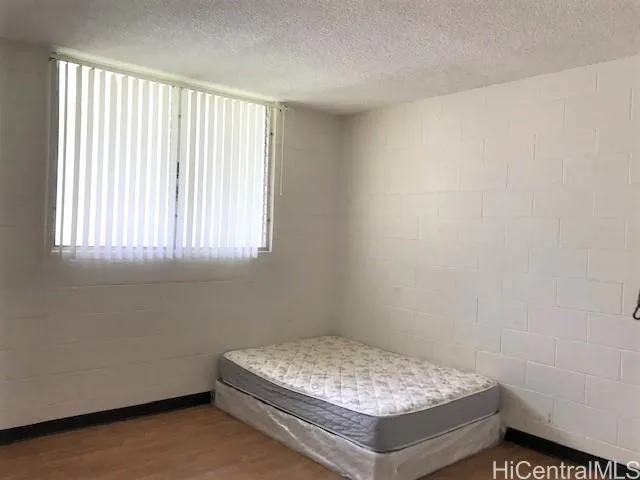 a room with a bed and a window