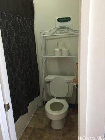 a bathroom with a toilet