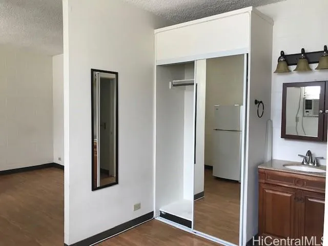 a view of a bathroom with a sink and mirror