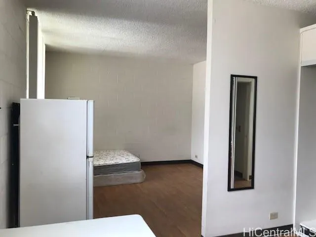 a view of a livingroom with furniture and window