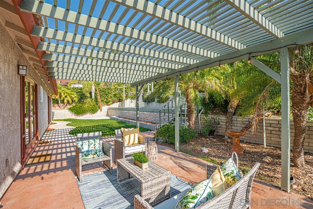 2506 Windmill View Road El Cajon, CA 92020 - Photo 19 of 25 REAR PATIO WITH PERGOLA. BACK YARD ALSO HAS A GRASS AREA AND RAISED DECK