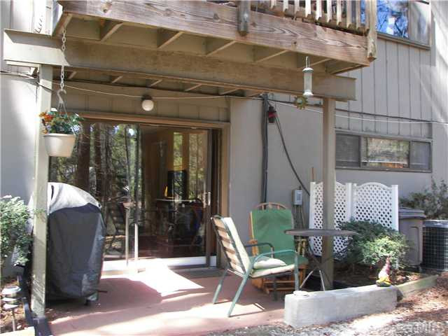 641 Pine Ridge Place Raleigh, NC 27609 - Photo 11 of 25 a view of a patio with table and chairs and potted plants