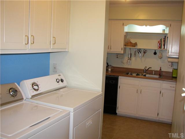 641 Pine Ridge Place Raleigh, NC 27609 - Photo 17 of 25 a utility room with faucet washer and dryer