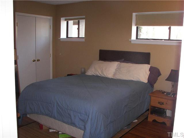 641 Pine Ridge Place Raleigh, NC 27609 - Photo 18 of 25 a bedroom with a bed and a window