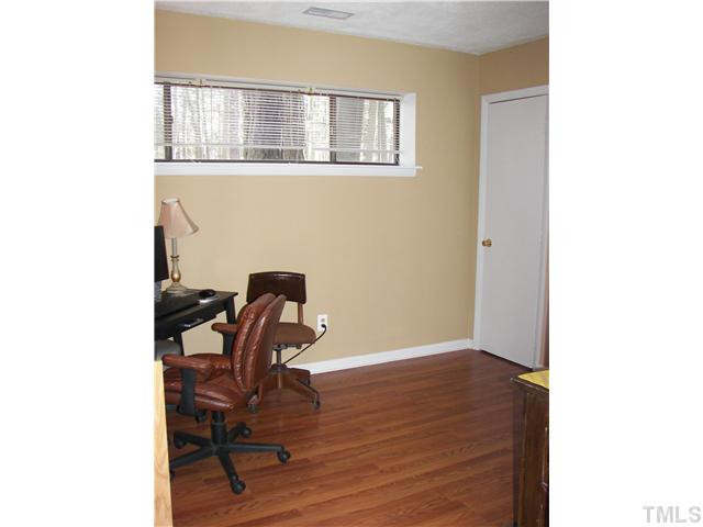 641 Pine Ridge Place Raleigh, NC 27609 - Photo 22 of 25 a view of a workspace with furniture and a window
