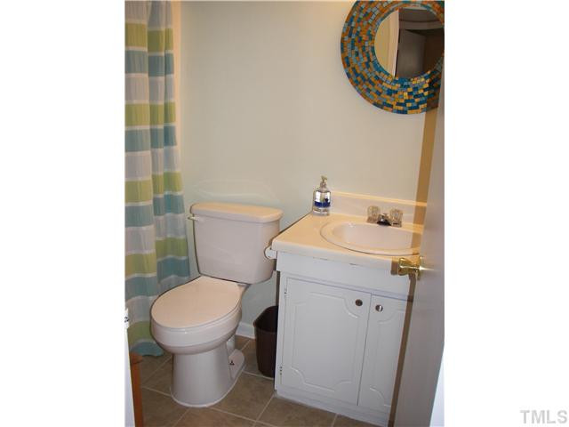 641 Pine Ridge Place Raleigh, NC 27609 - Photo 23 of 25 a bathroom with a toilet and a sink