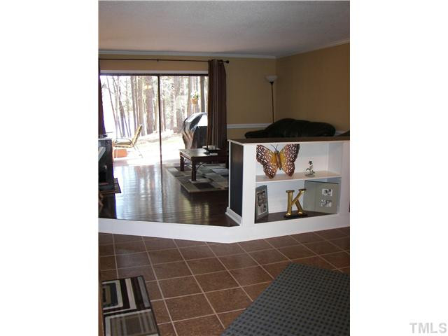 641 Pine Ridge Place Raleigh, NC 27609 - Photo 3 of 25 a room with table and chairs