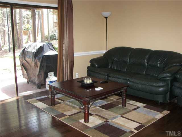 641 Pine Ridge Place Raleigh, NC 27609 - Photo 4 of 25 a living room with a table