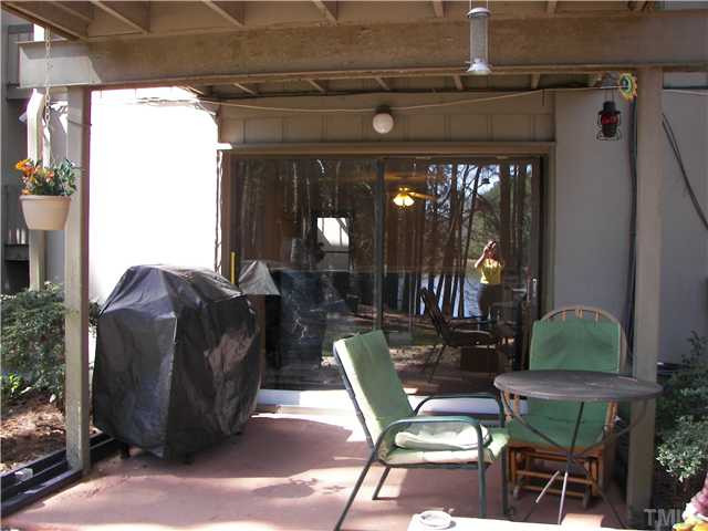641 Pine Ridge Place Raleigh, NC 27609 - Photo 7 of 25 a view of a chairs and tables in patio