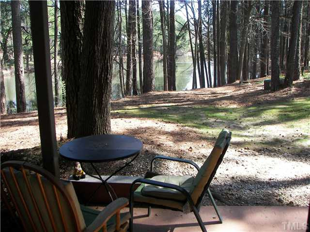 641 Pine Ridge Place Raleigh, NC 27609 - Photo 10 of 25 a view of a wooden chairs and backyard of the house