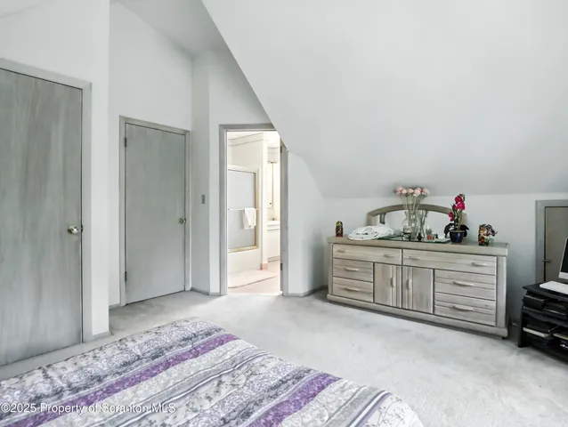 a bed room with a bed and a dresser