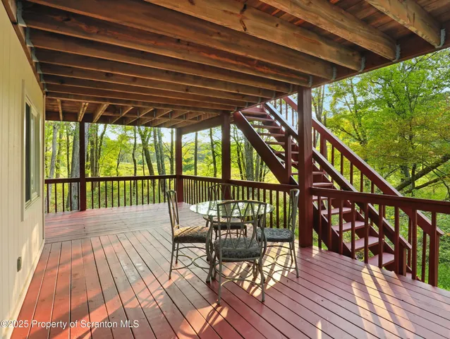 a view of balcony with wooden floor