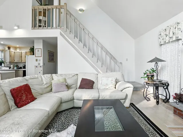 a living room with furniture and a rug