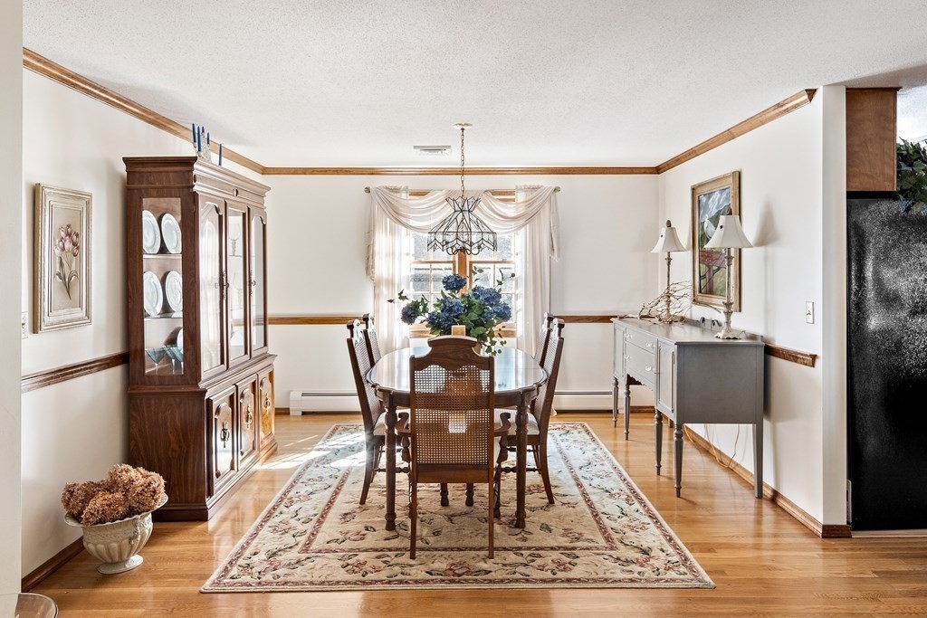 111 Seth Parker Road Barnstable, MA 02632 - Photo 17 of 27 a view of a dining room with furniture window and wooden floor