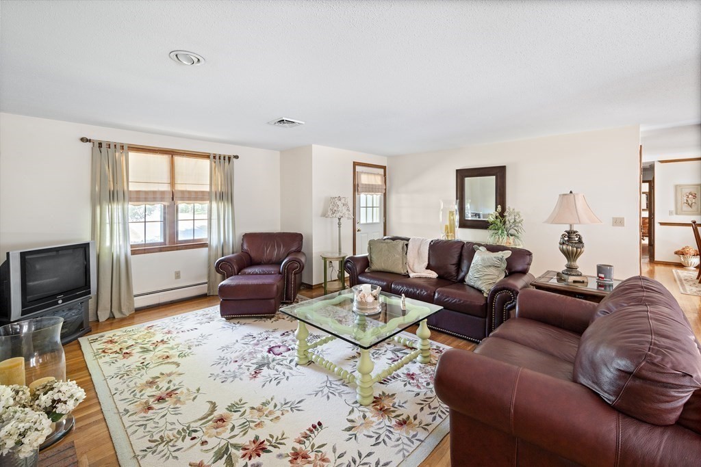 111 Seth Parker Road Barnstable, MA 02632 - Photo 4 of 27 a living room with furniture window and a flat screen tv