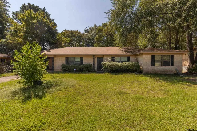 a view of a house with a garden