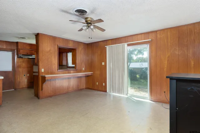 a view of living room with furniture and a window