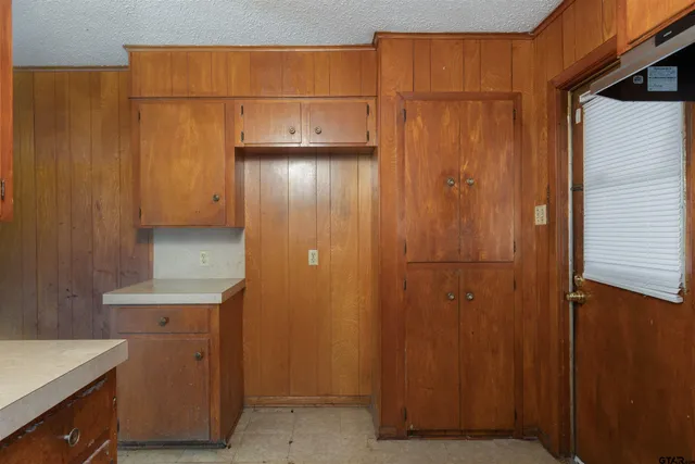 a view of a storage and utility room with a sink