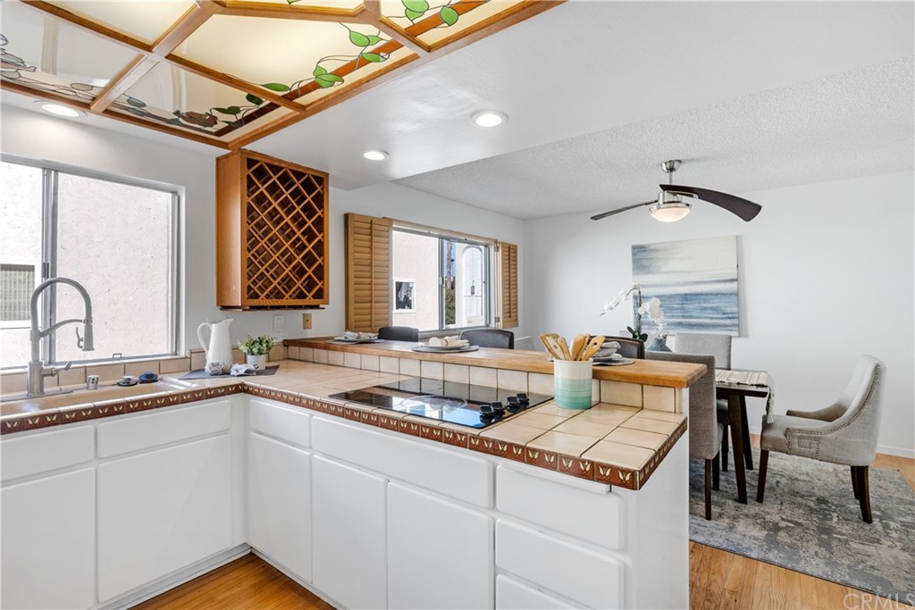 259 Valley Drive Hermosa Beach, CA 90254 - Photo 13 of 34 a kitchen with a sink cabinets and wooden floor