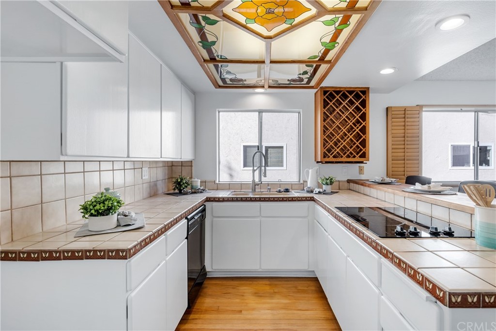 259 Valley Drive Hermosa Beach, CA 90254 - Photo 14 of 34 a kitchen with a stove sink and cabinets