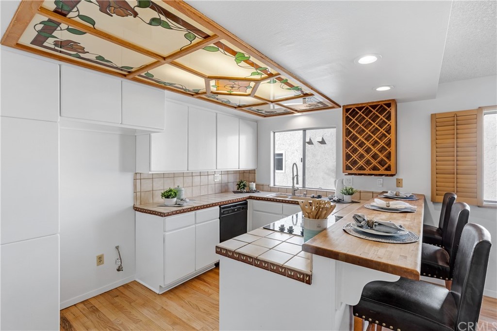 259 Valley Drive Hermosa Beach, CA 90254 - Photo 15 of 34 a kitchen with a sink cabinets and wooden floor