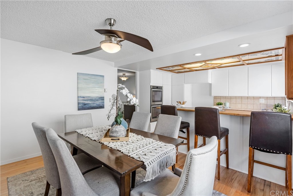 259 Valley Drive Hermosa Beach, CA 90254 - Photo 17 of 34 a view of a dining room with furniture window and wooden floor