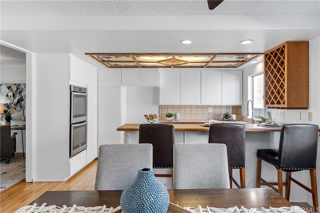 259 Valley Drive Hermosa Beach, CA 90254 - Photo 19 of 34 a kitchen with stainless steel appliances granite countertop a refrigerator and a stove top oven
