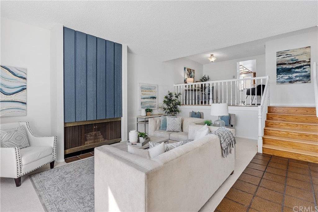 259 Valley Drive Hermosa Beach, CA 90254 - Photo 2 of 34 a living room with furniture and a fireplace