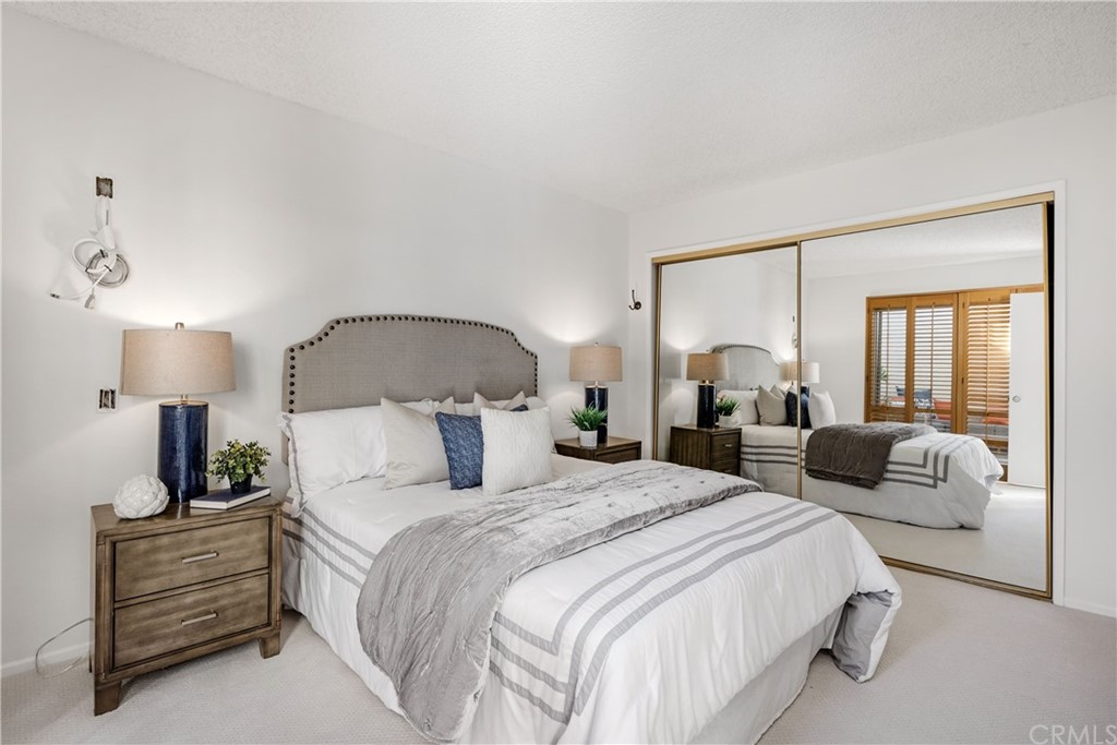 259 Valley Drive Hermosa Beach, CA 90254 - Photo 25 of 34 a bedroom with bed and a large mirror