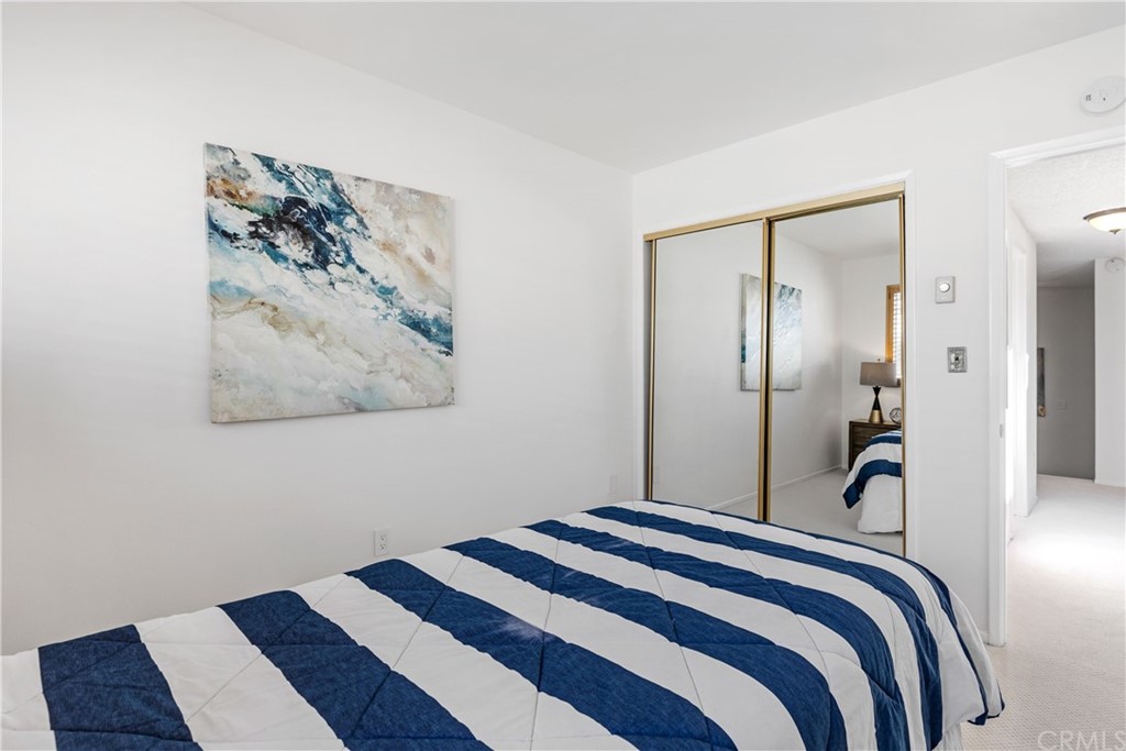 259 Valley Drive Hermosa Beach, CA 90254 - Photo 28 of 34 a bedroom with a bed and a painting on the wall