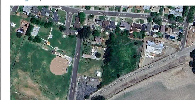 a view of a lake with a yard