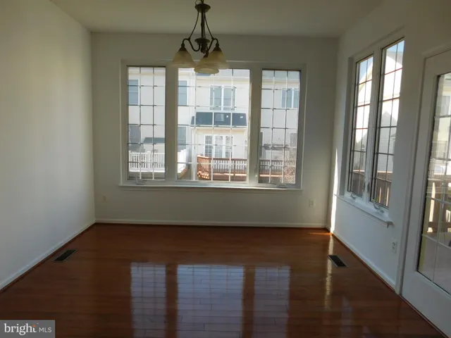 a view of a glass door and a window