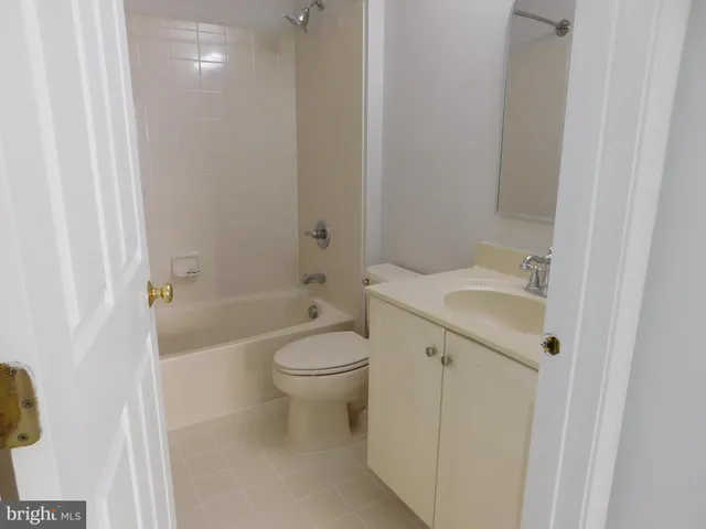 a view of an empty room and a window