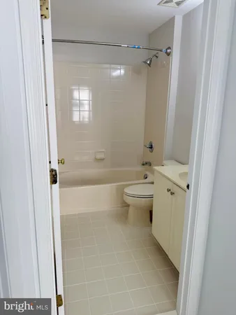 a bathroom with a double vanity sink toilet and shower