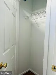 a view of a room with wooden floor and staircase