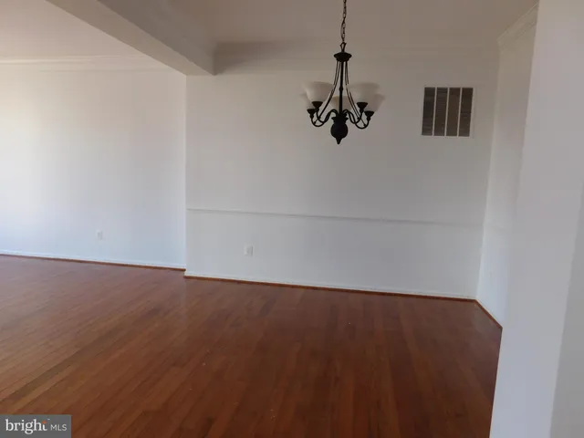a white toilet sitting next to a white sink