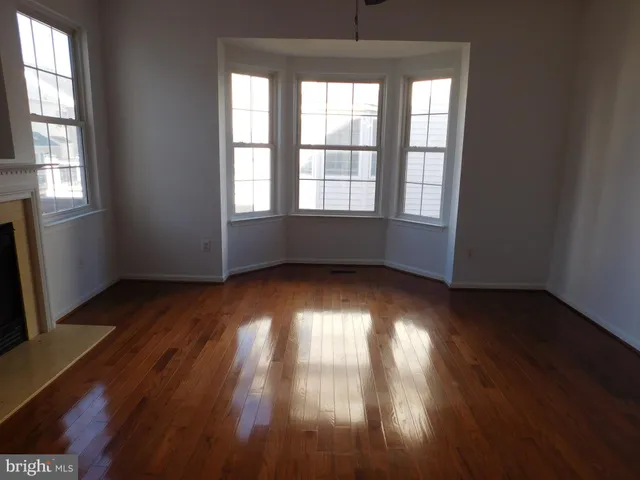 a kitchen with a refrigerator a sink and cabinets