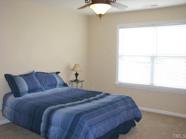 125 Locke Woods Road Raleigh, NC 27603 - Photo 11 of 12 All of the secondary bedrooms, including the 1st floor guest bedroom are generous in size and feature upgraded ceiling fans with remotes