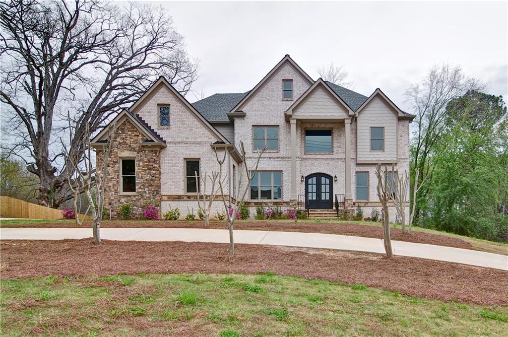 920 Old Canton Road Marietta, GA 30068 - Photo 1 of 1 Beautiful 4 sided brick home with stone accents. 2 grand columns. Circular driveway with plenty of parking for guests!