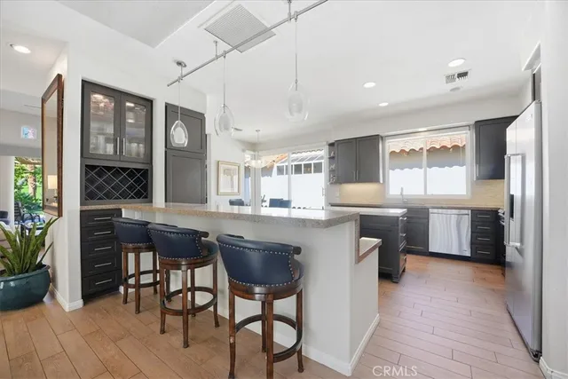 a kitchen with a table and chairs in it