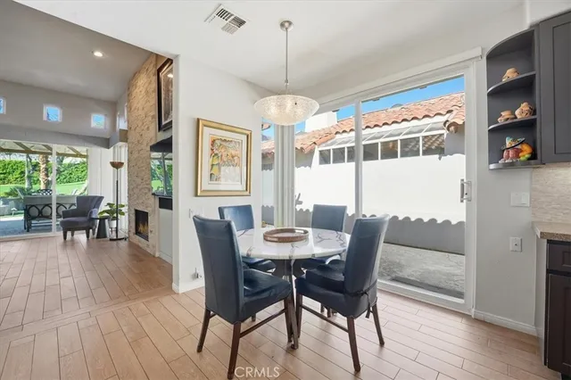 a dining room with furniture window wooden floor
