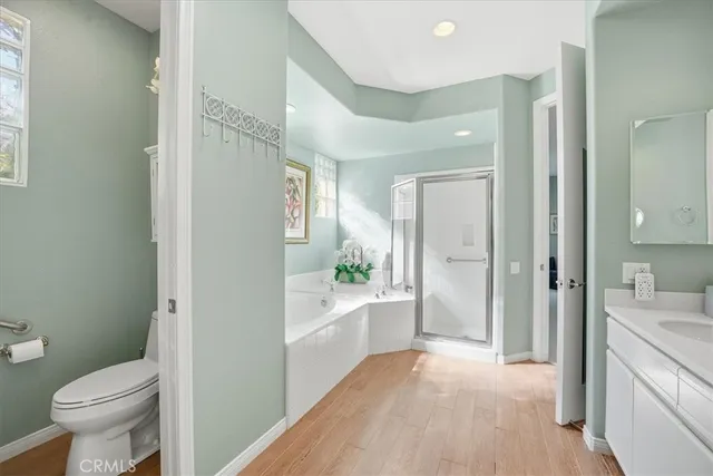 a bathroom with a sink a toilet a tub and shower